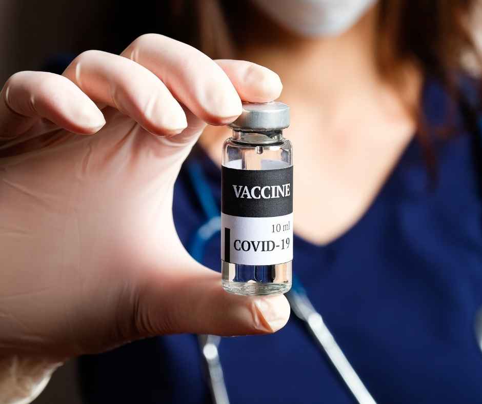 Nurse holding covid vaccine